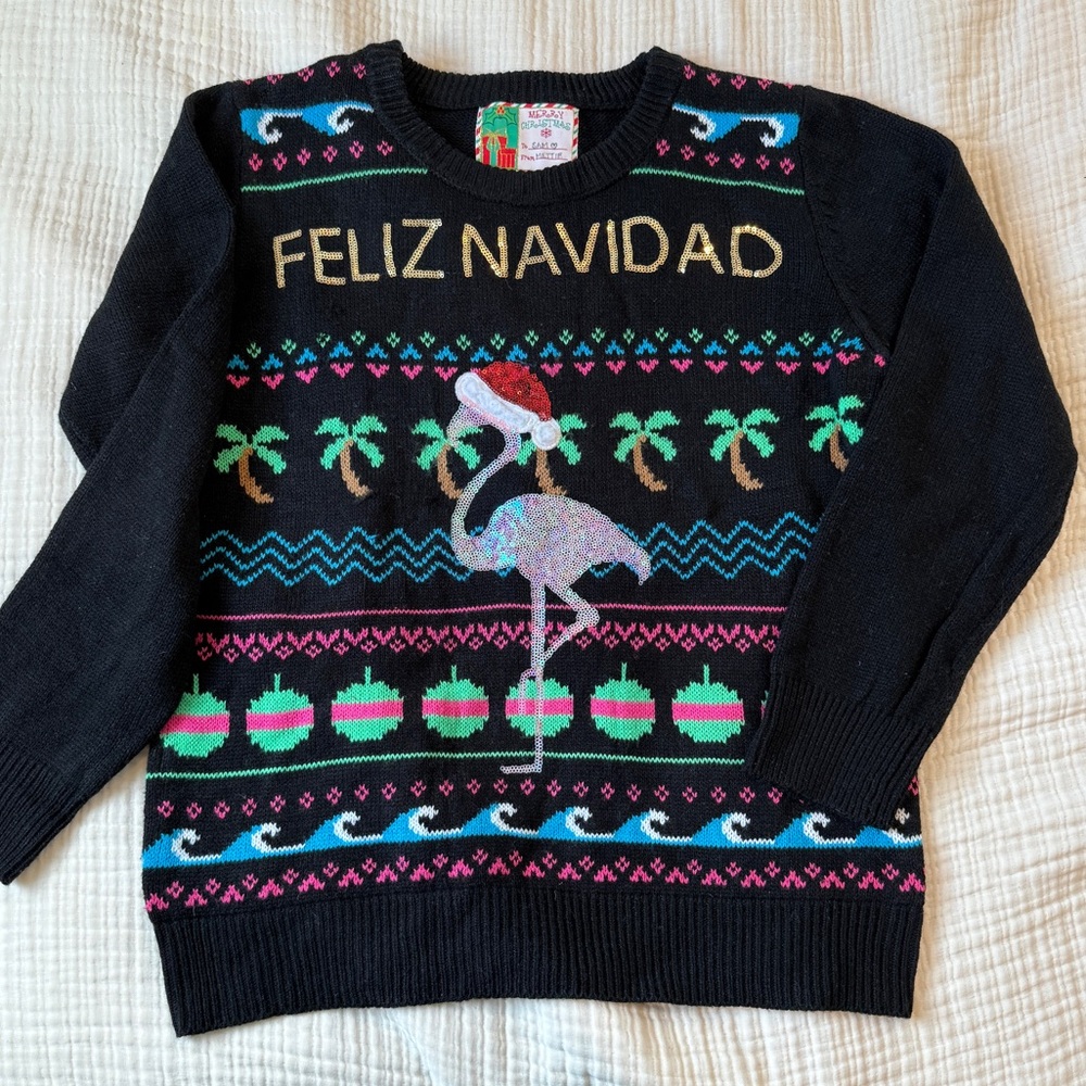 Black Feliz Navidad Ugly Sweater with Sequin Flamingo Design